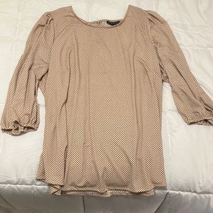 Women’s top, rose blush with black dots.